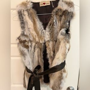 Love Token faux rabbit fur vest with detachable ribbon at the waist. Size small.